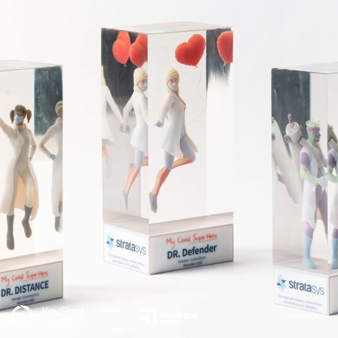 Stratasys My COVID Hero serisi: şeffaf bloklar içinde Dr. Distance ve Dr. Defender figürlerinin KeyShot render'ı